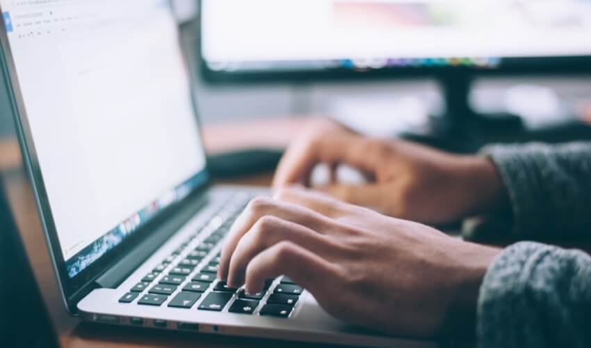 Person typing on a computer